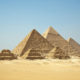 Huge pyramids of Giza with three small pyramids in front